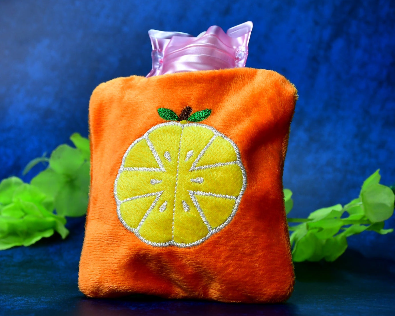 Small orange hot water bag for neck and shoulder pain relief