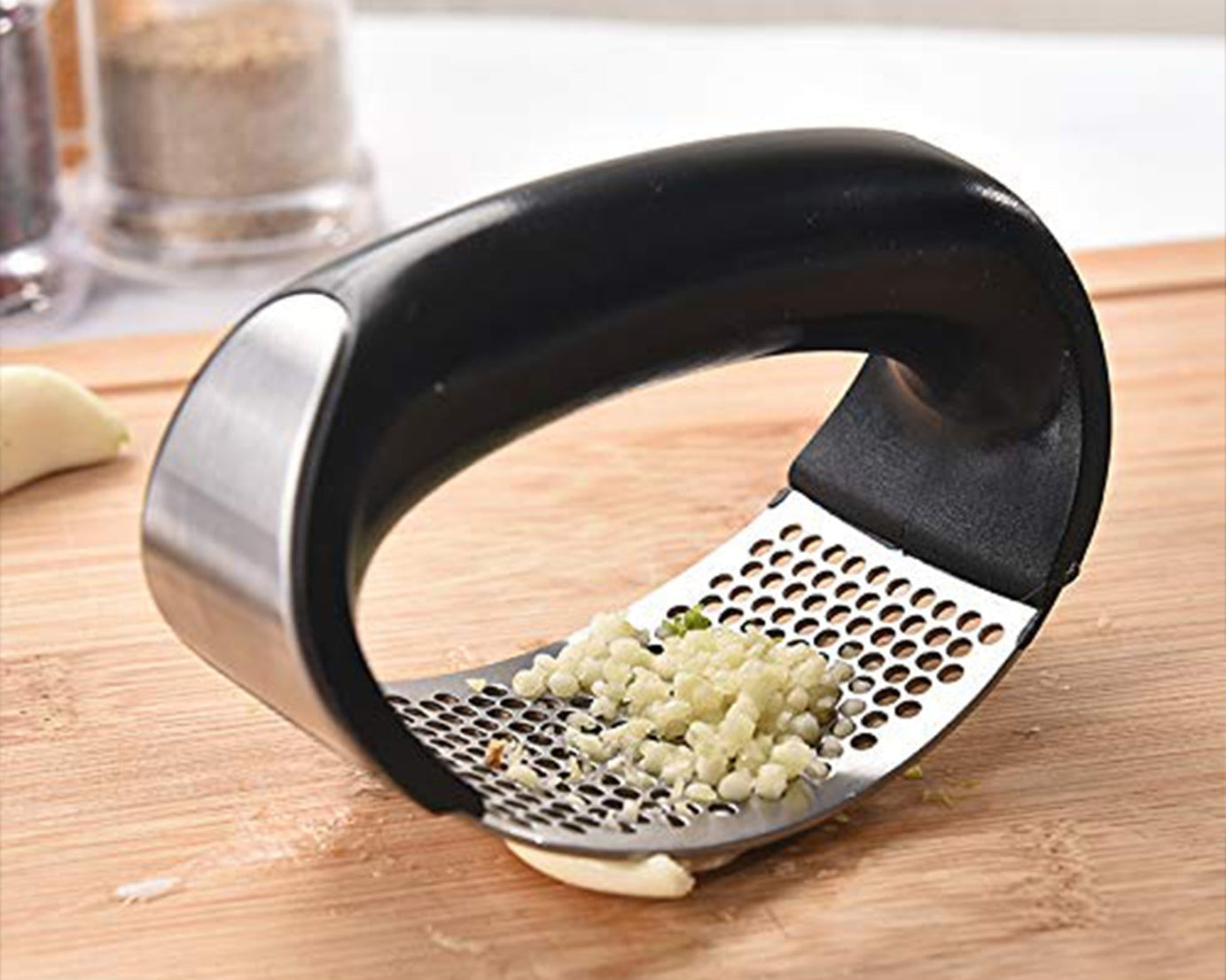 Durable stainless steel garlic crusher in vibrant colors.