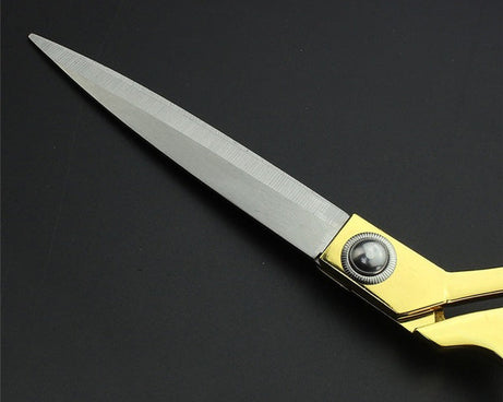 Gold-plated professional scissors for seamless fabric cuts.