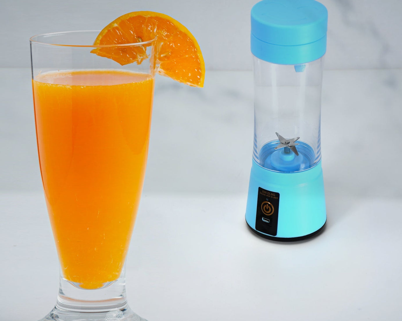 Portable juicer cup with 6 blades for efficient juicing.