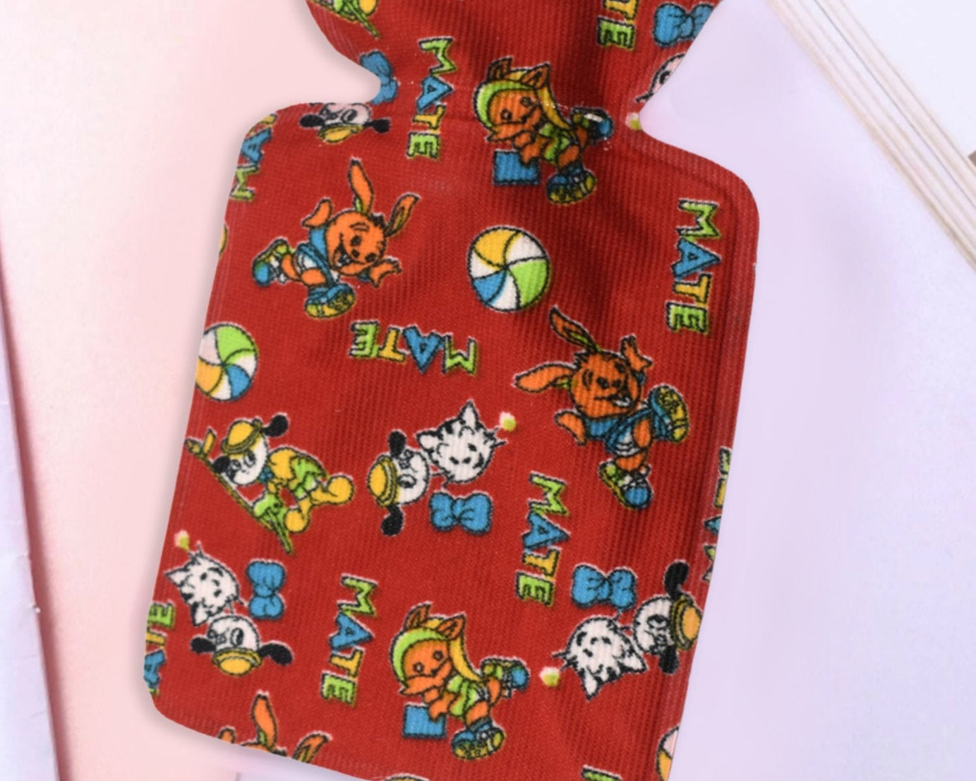 Personal care hot water bottle for pain relief, compact size.