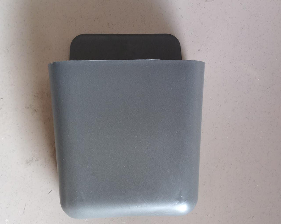 Multicolour remote storage organizer, wall mounted.