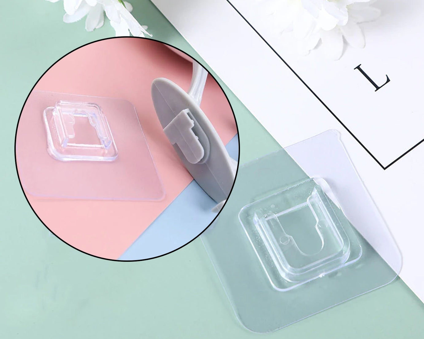 Wall hook with adhesive backing, plastic design.