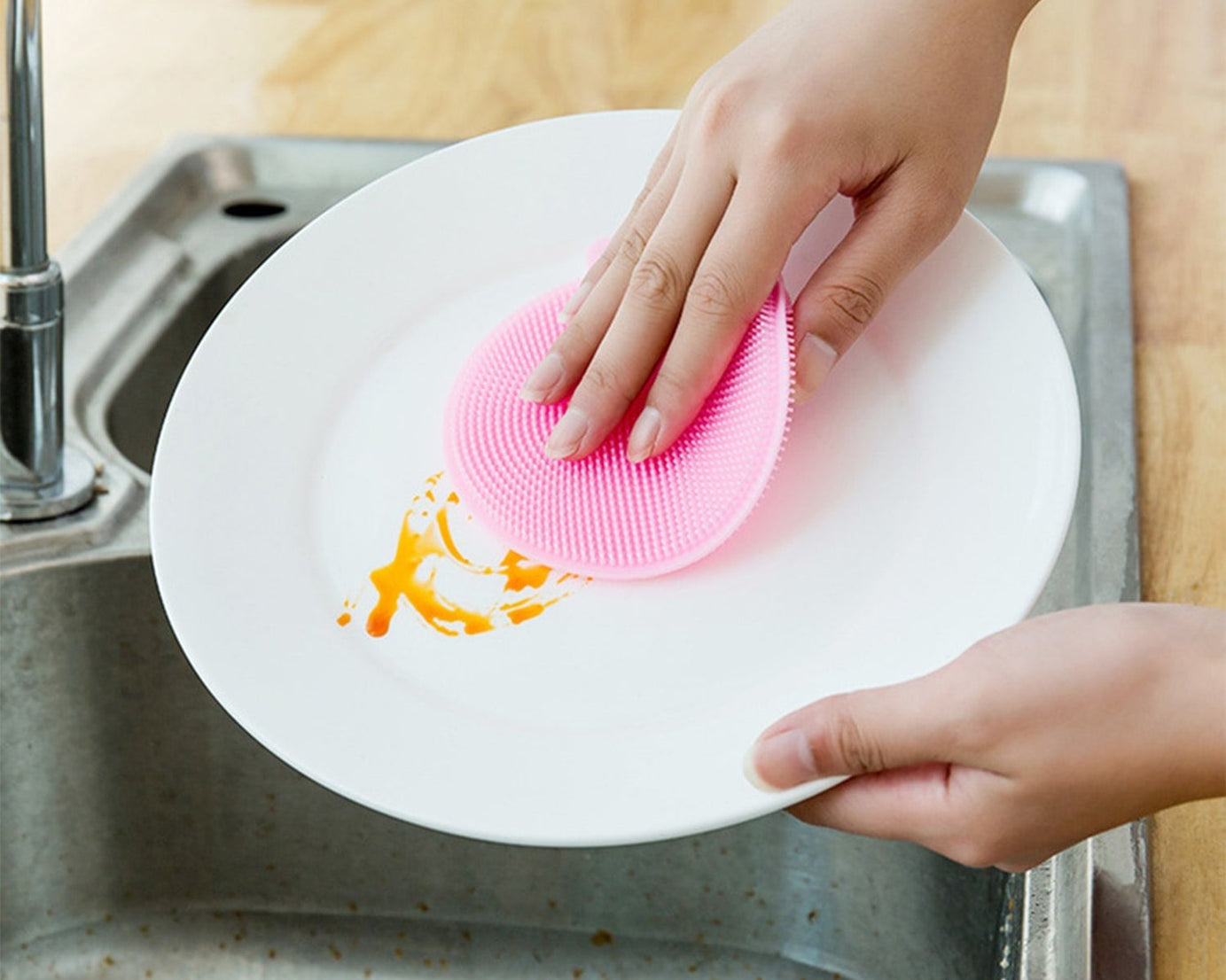 Mildew-free silicone dish sponge in assorted colors for easy scrubbing.