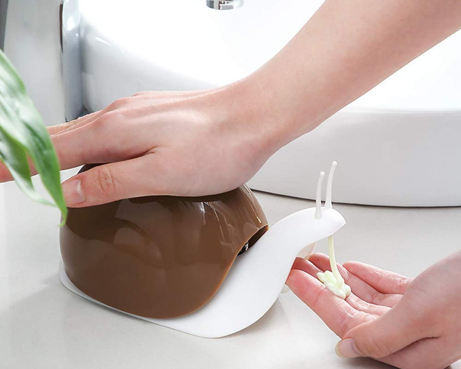 Portable soap dispenser in snail shape for easy handling and use.