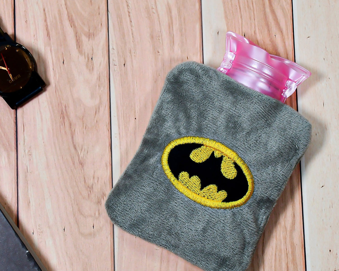 Batman-themed hot water bag for pain relief and warmth