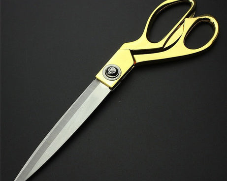 Premium cloth cutting scissors with gold finish.