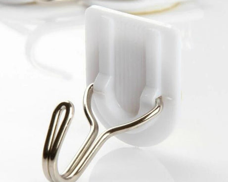 White plastic hook for hanging kitchen towels.