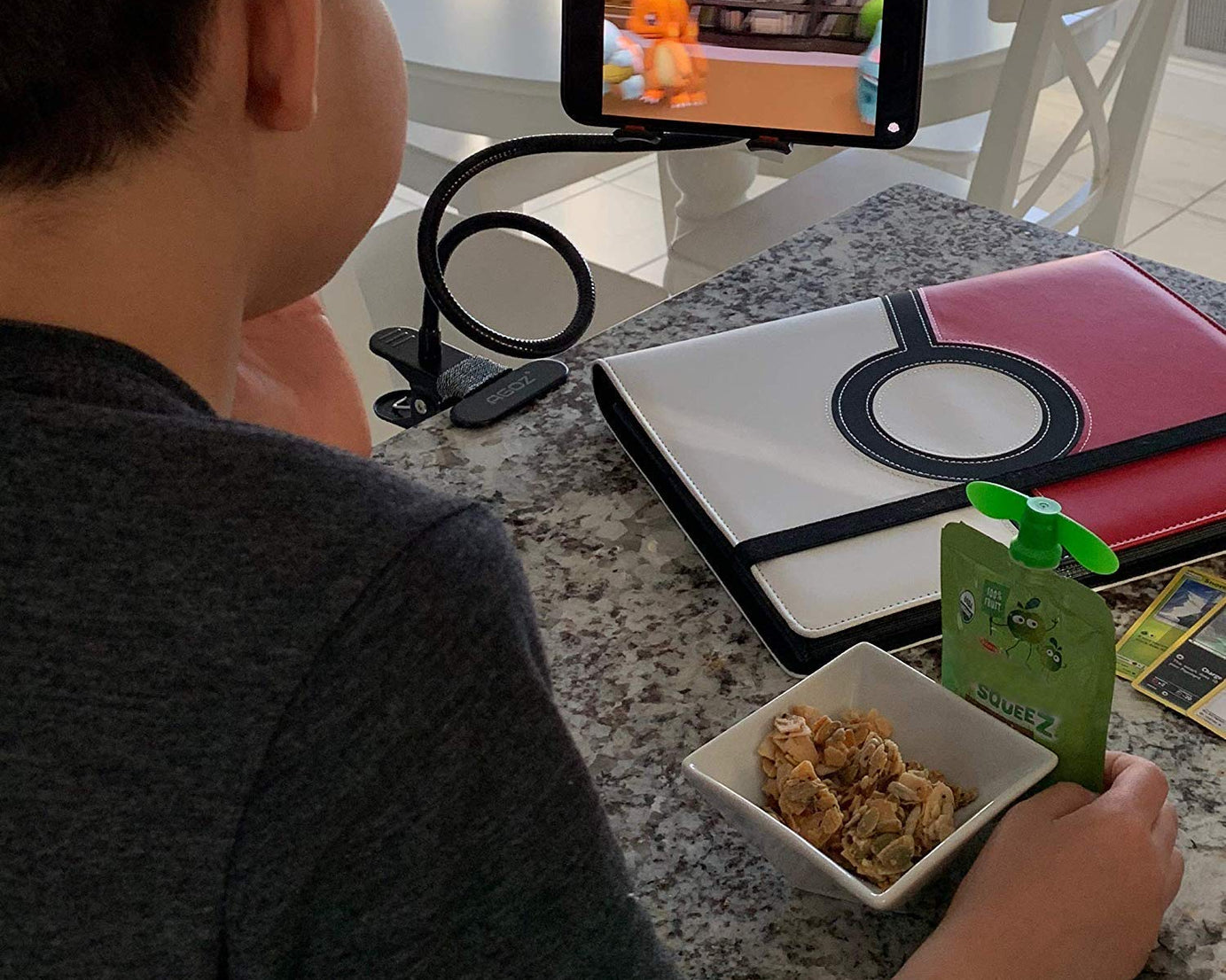 Foldable metal stand for phones, flexible use.