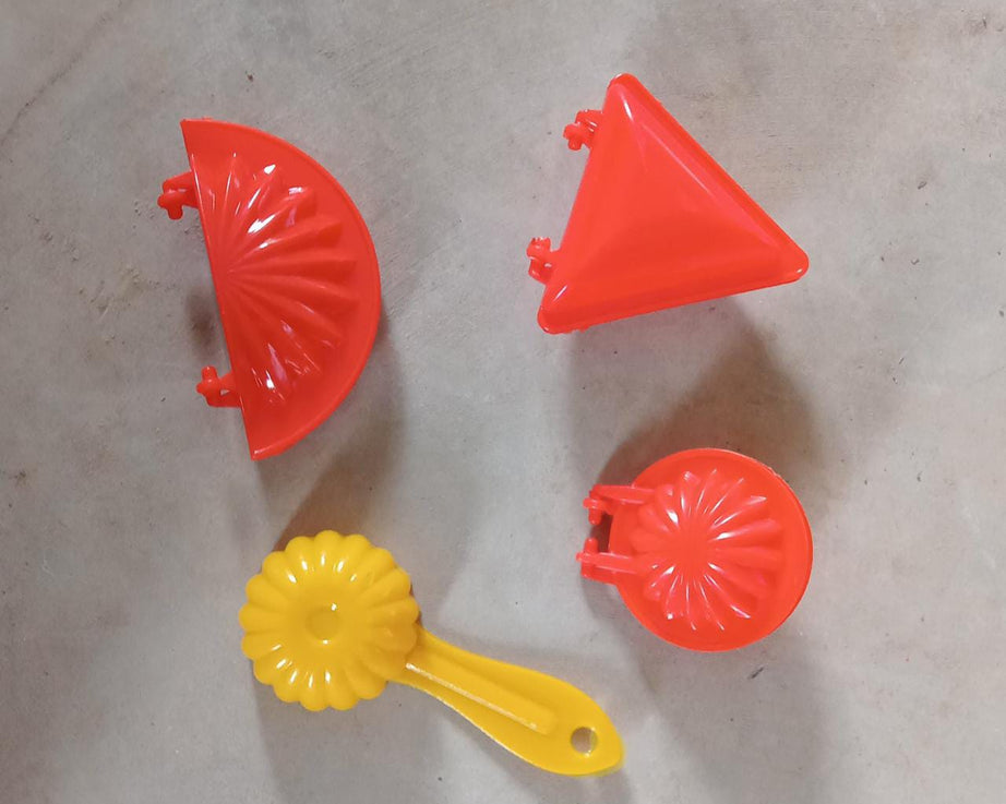 Four-piece set of red plastic kitchen dough press molds