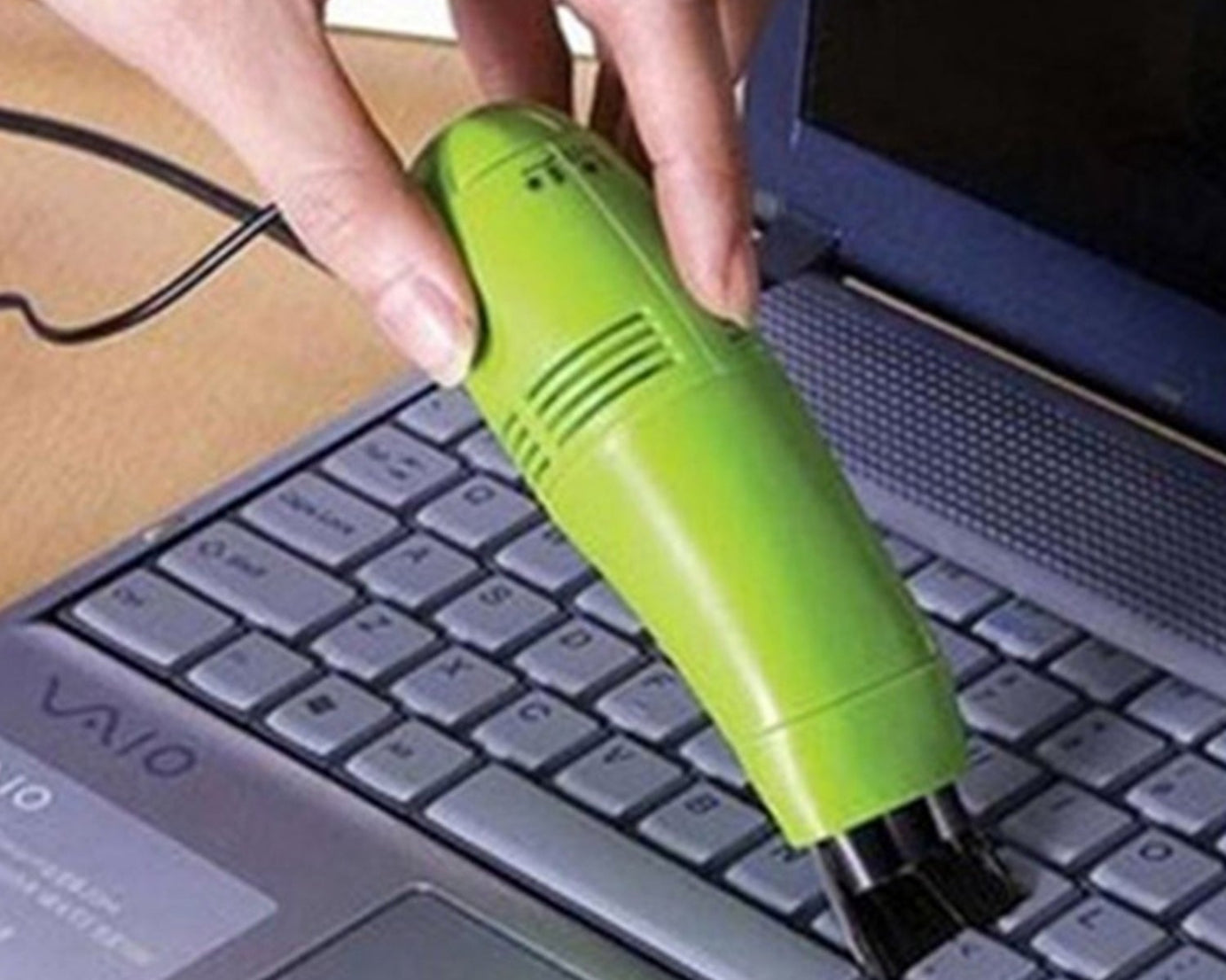 Convenient mini vacuum cleaner for cleaning hard-to-reach areas in cars and computers.