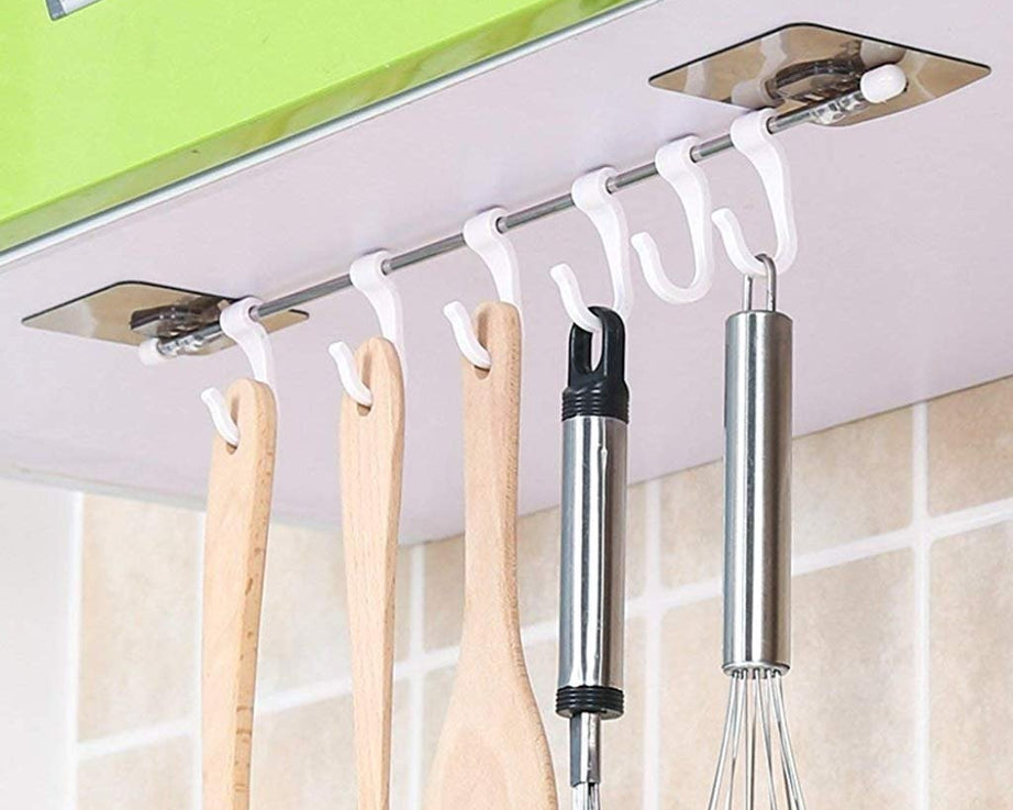 Adhesive hanger hooks, plastic, for organizing items securely.