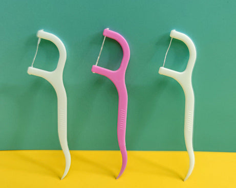 Convenient floss sticks for maintaining oral hygiene.