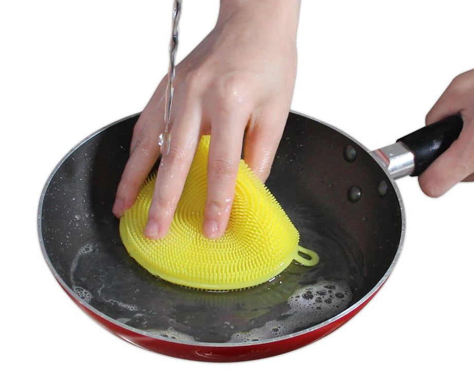 Non-stick silicone scrubber sponge, resistant to heat and mildew.