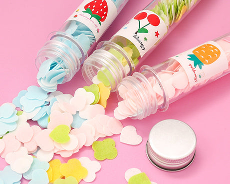 Paper soap strips in floral design, stored in a test tube.