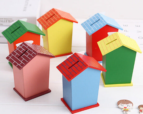 Cartoon piggy bank with house design