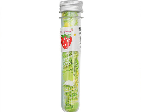 Flower-shaped paper soap strips in a clear test tube bottle.