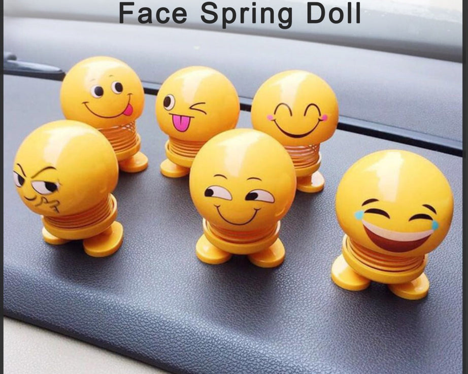 Spring doll with smiley face emoticon