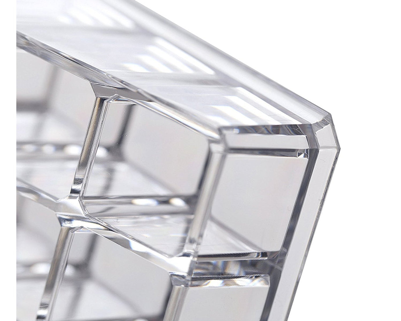 Clear acrylic display stand for cosmetics with 24 compartments, focusing on its practical use