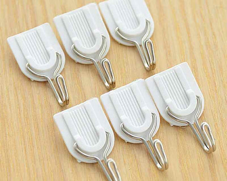 Self-adhesive hook for bathroom or kitchen.