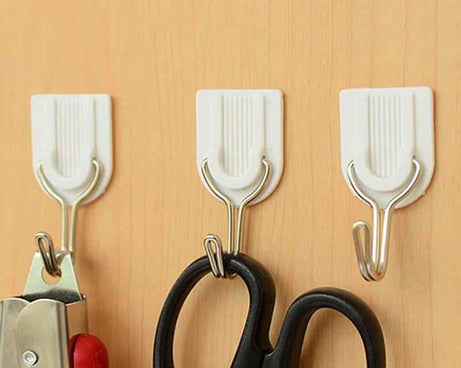 Wall hook for towels with adhesive backing.