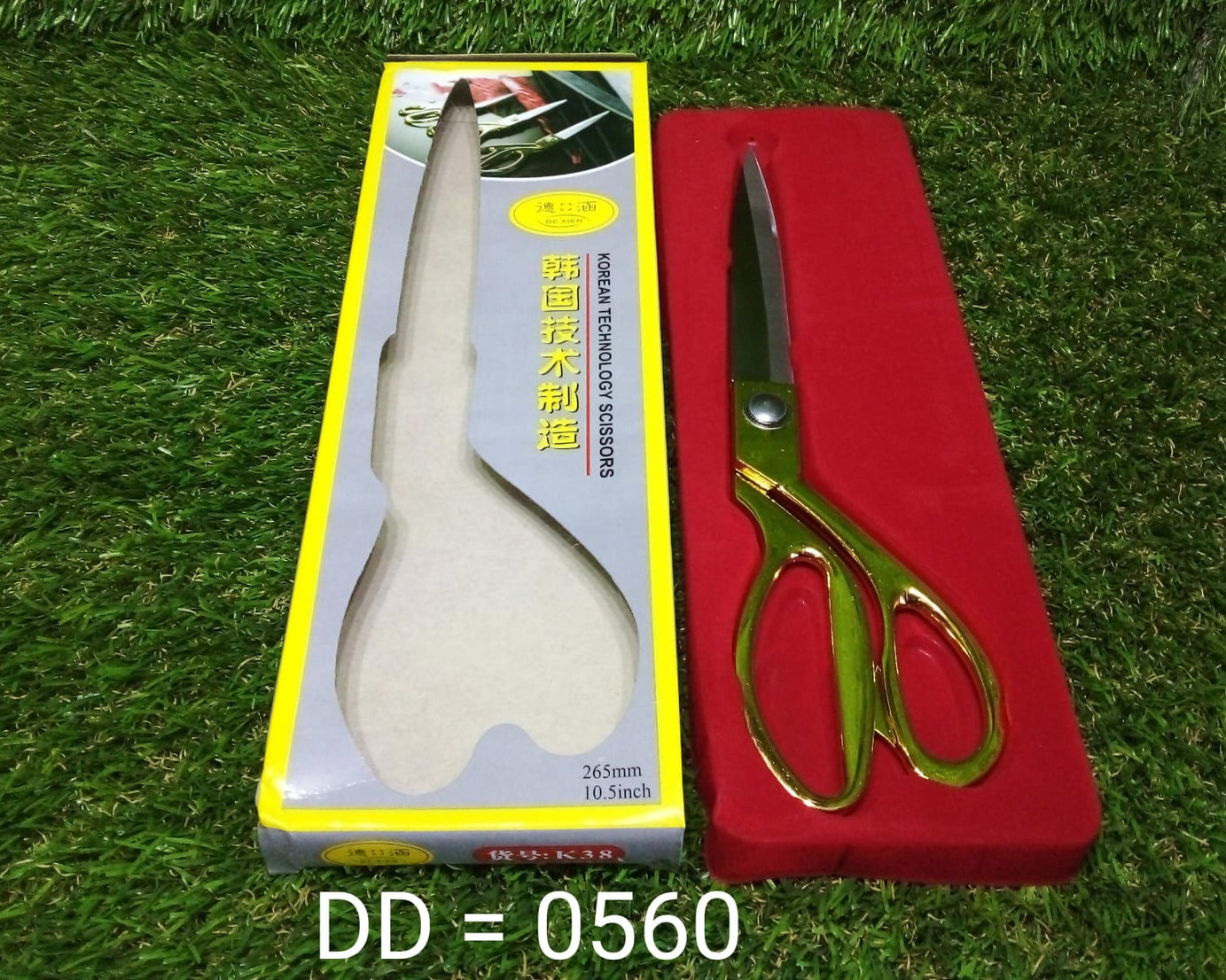 Sharp and stylish gold-plated scissors for fabric cutting.